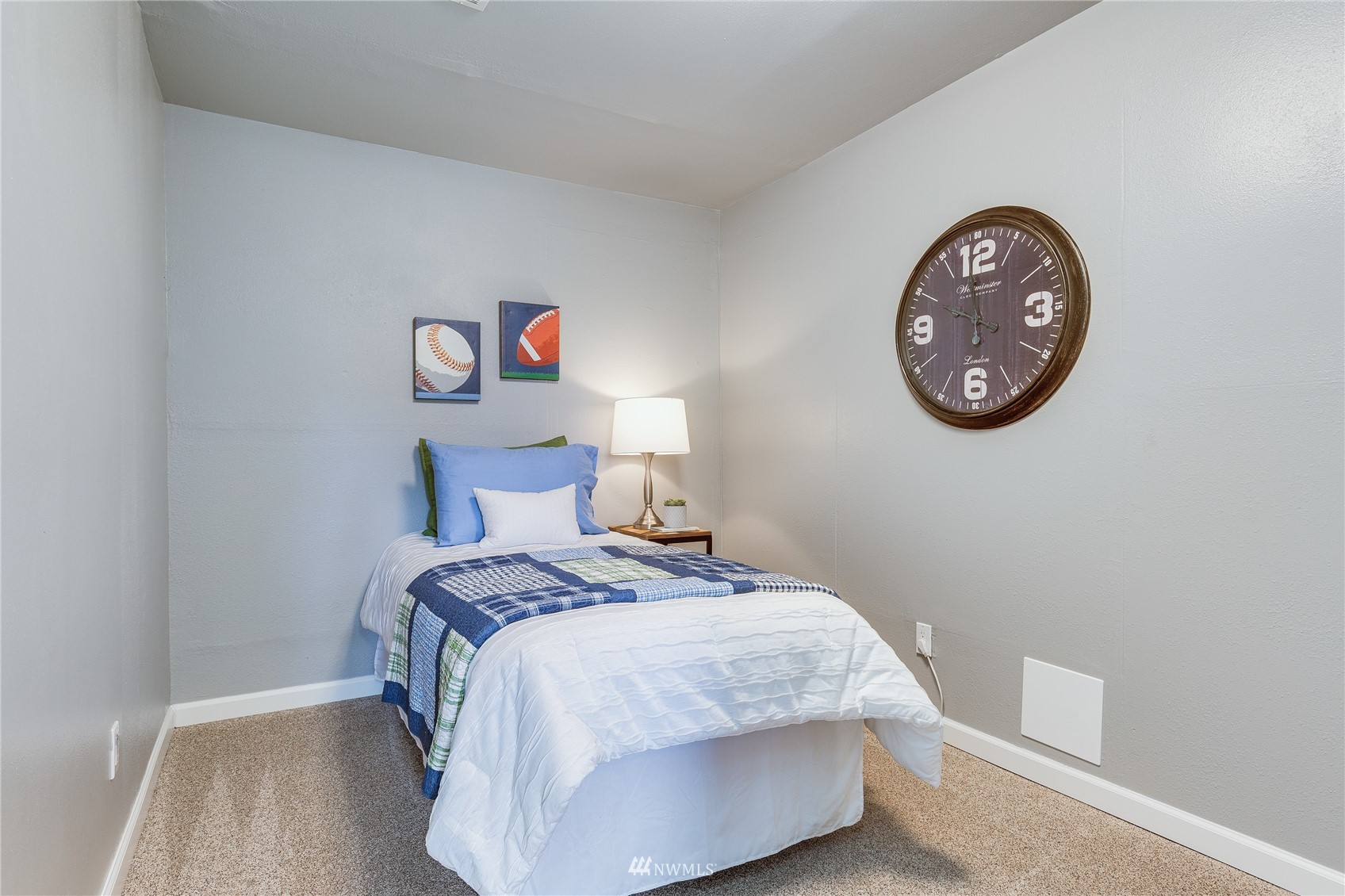 504 240th Street Southwest Bothell, WA 98021 - Photo 28 of 40 a bedroom with a bed and a table