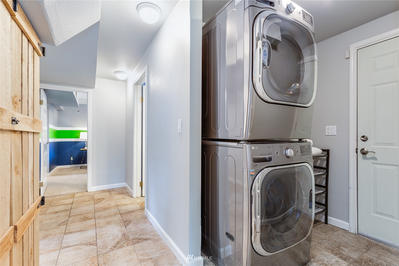 504 240th Street Southwest Bothell, WA 98021 - Photo 30 of 40 a view of a storage and utility room with dryer and washer