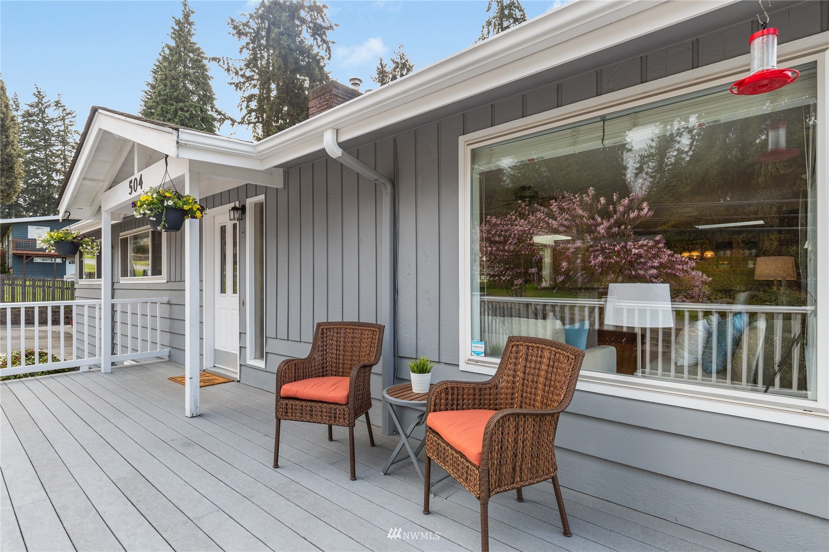 504 240th Street Southwest Bothell, WA 98021 - Photo 3 of 40 a view of a chair and tables in the balcony