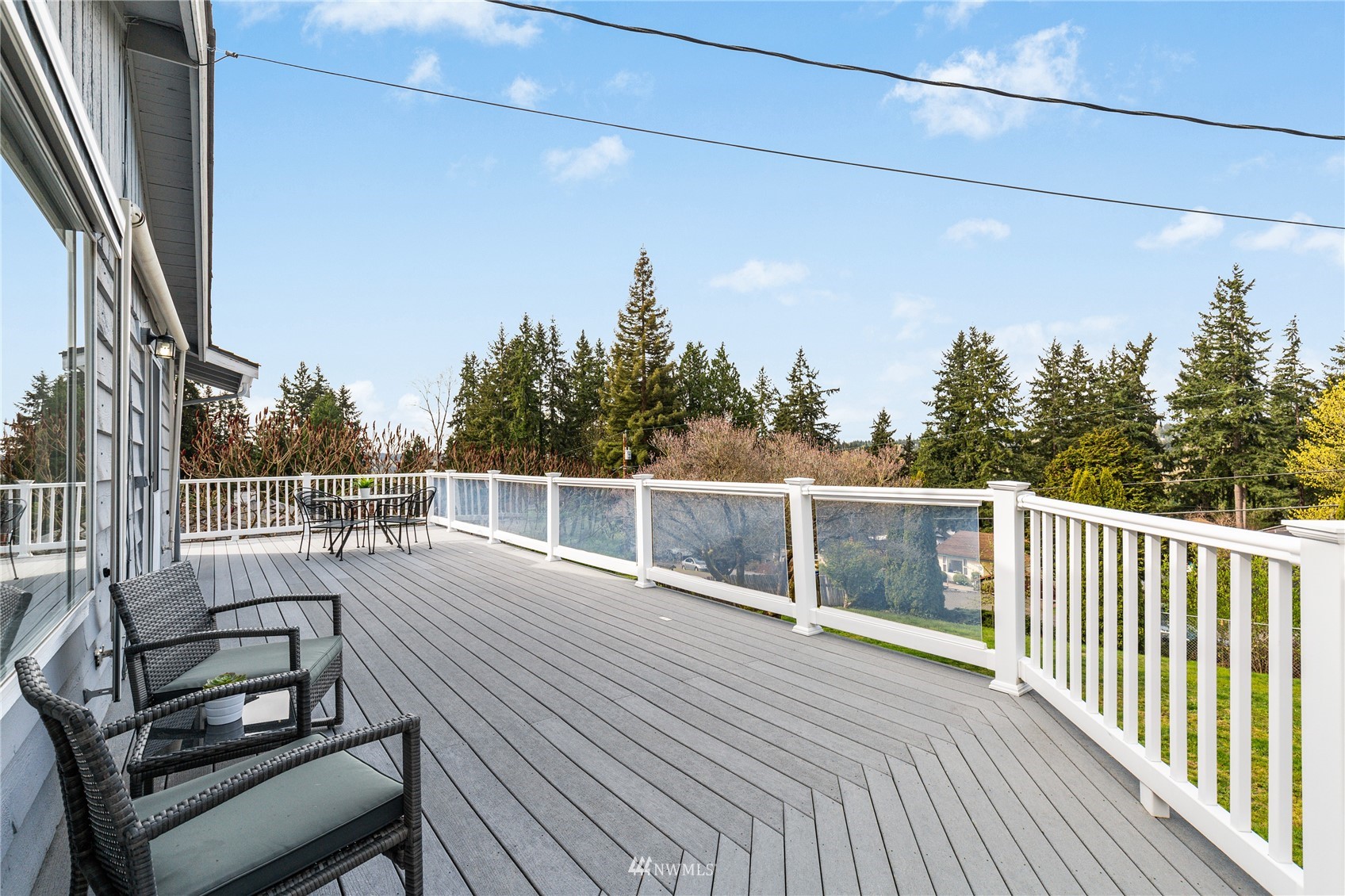 504 240th Street Southwest Bothell, WA 98021 - Photo 31 of 40 a view of a balcony with wooden floor and outdoor seating