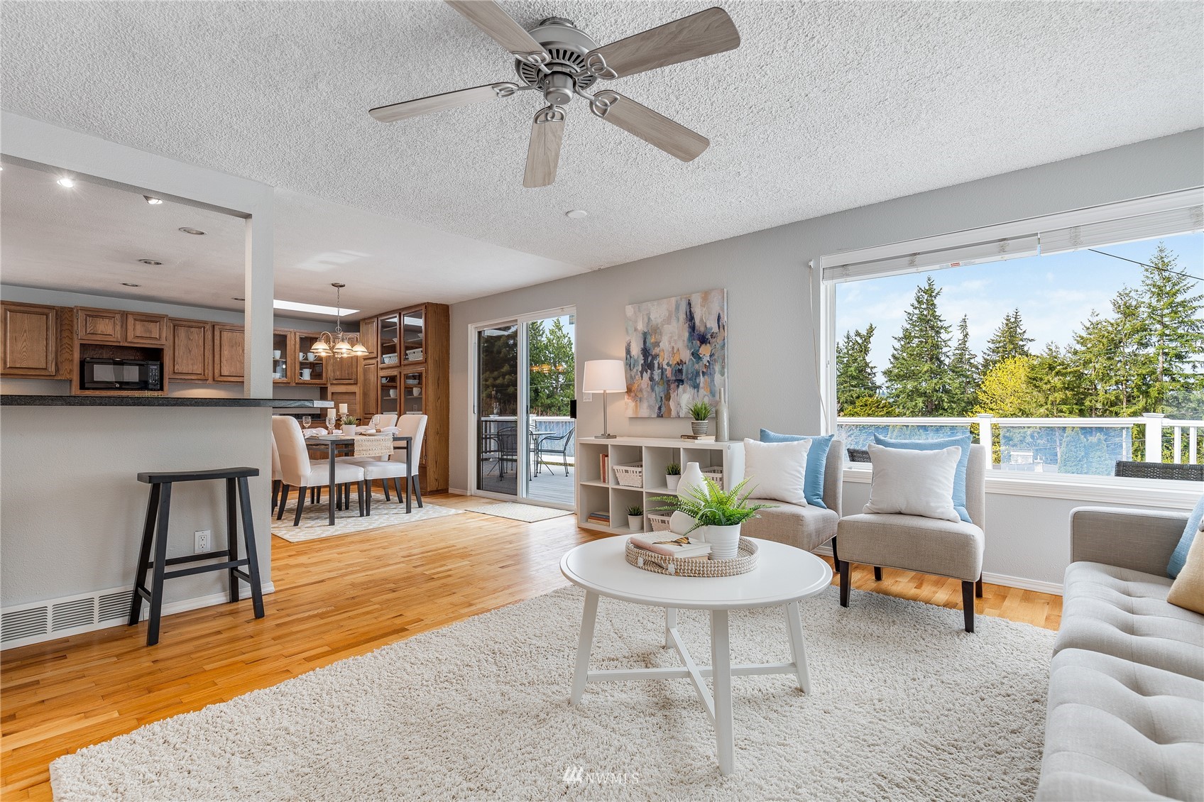 504 240th Street Southwest Bothell, WA 98021 - Photo 7 of 40 a living room with furniture and a large window