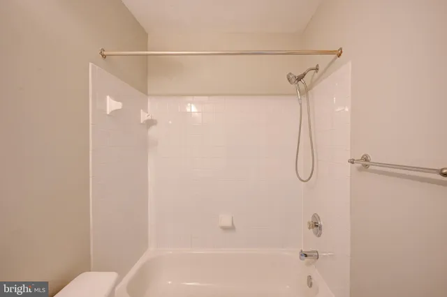 a bathroom with a shower and a shower
