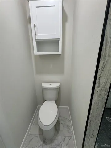 a bathroom with a toilet