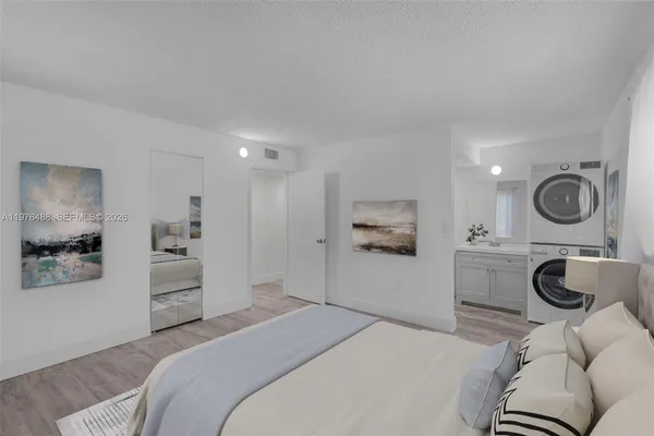 a bedroom with a bed and a couch