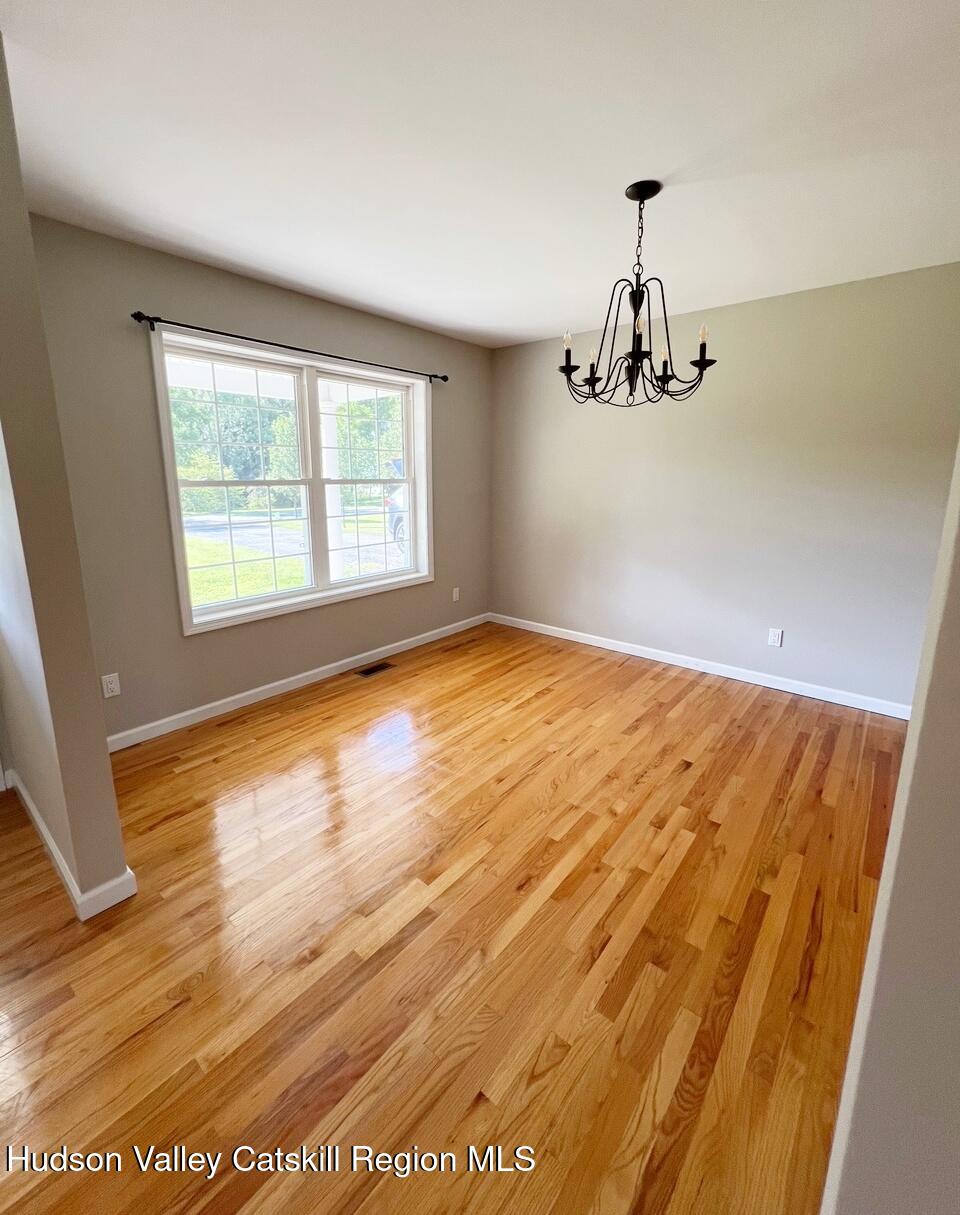24 Mountain View Road Amenia, NY 12501 - Photo 9 of 13 a view of empty room with wooden floor and fan