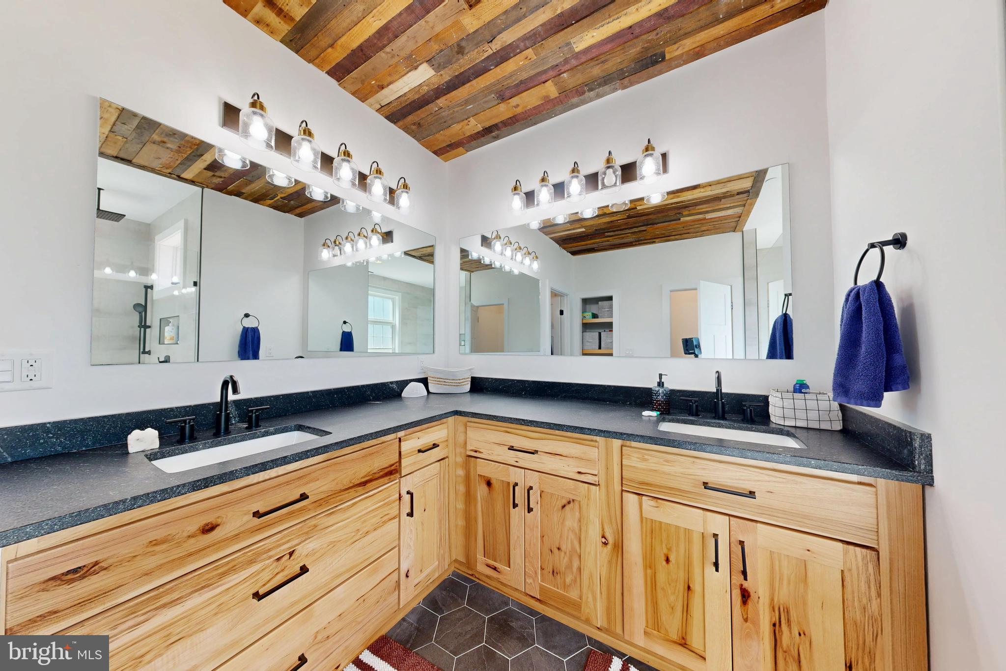 23730 Henry Road Ridgely, MD 21660 - Photo 17 of 28 a bathroom with double vanity and a mirror
