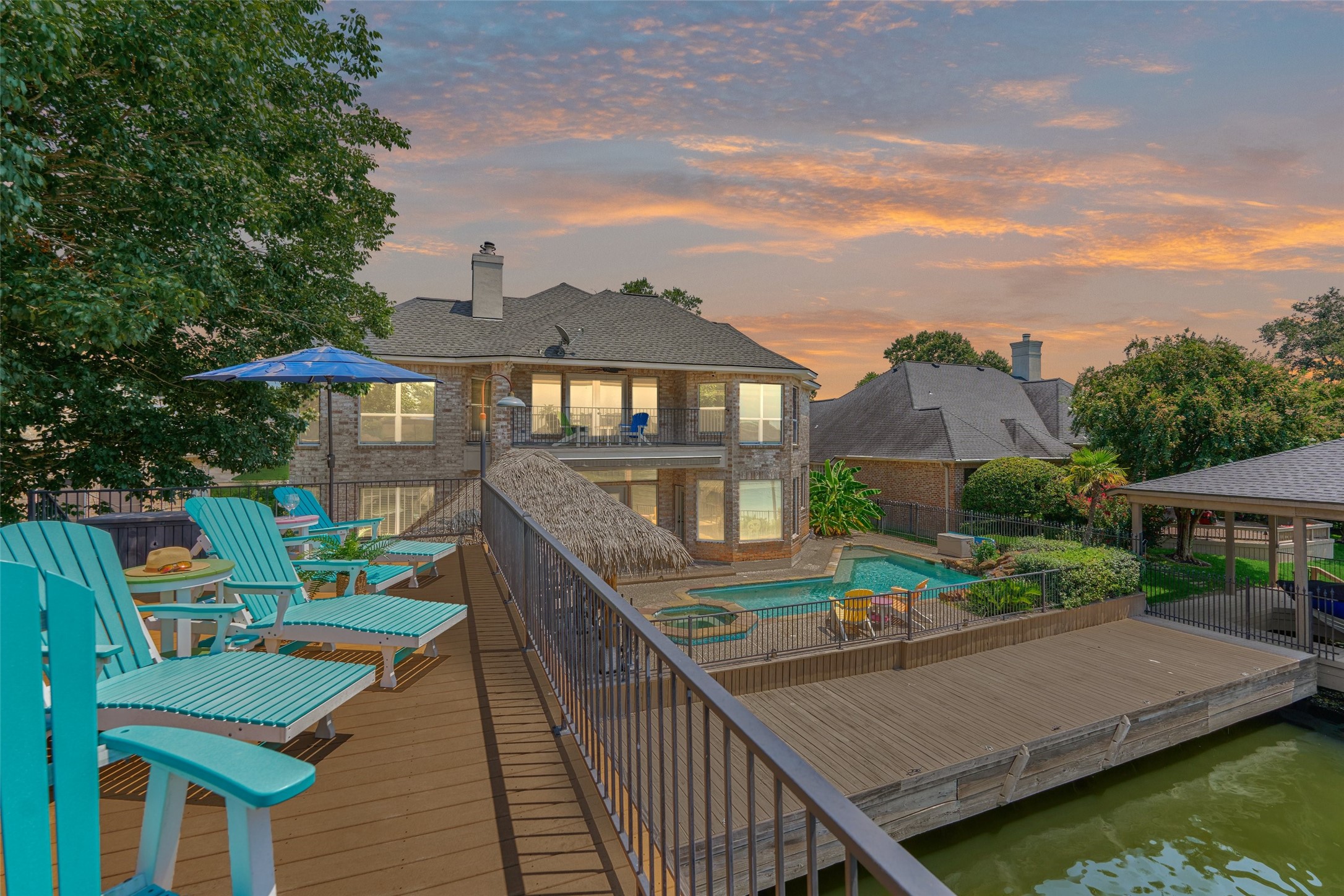 Expansive outdoor spaces, stunning lake views, and vibrant sunsets make this the ultimate lakefront retreat.