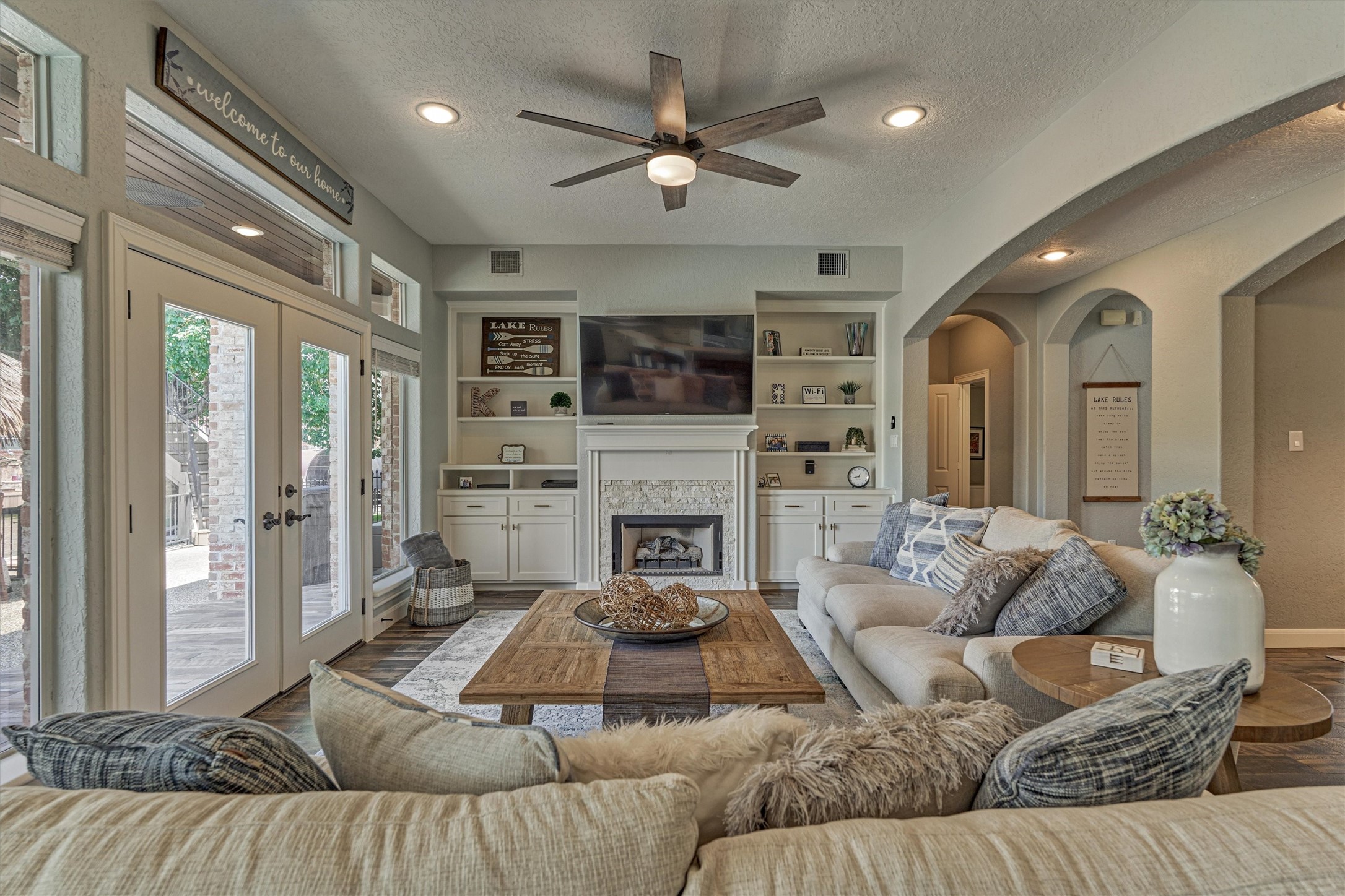 202 Edgemar Road Montgomery, TX 77356 - Photo 13 of 50 Open living that flows seamlessly to the pool and tiki bar—just step through the French doors and drop the Sunbrella shade.