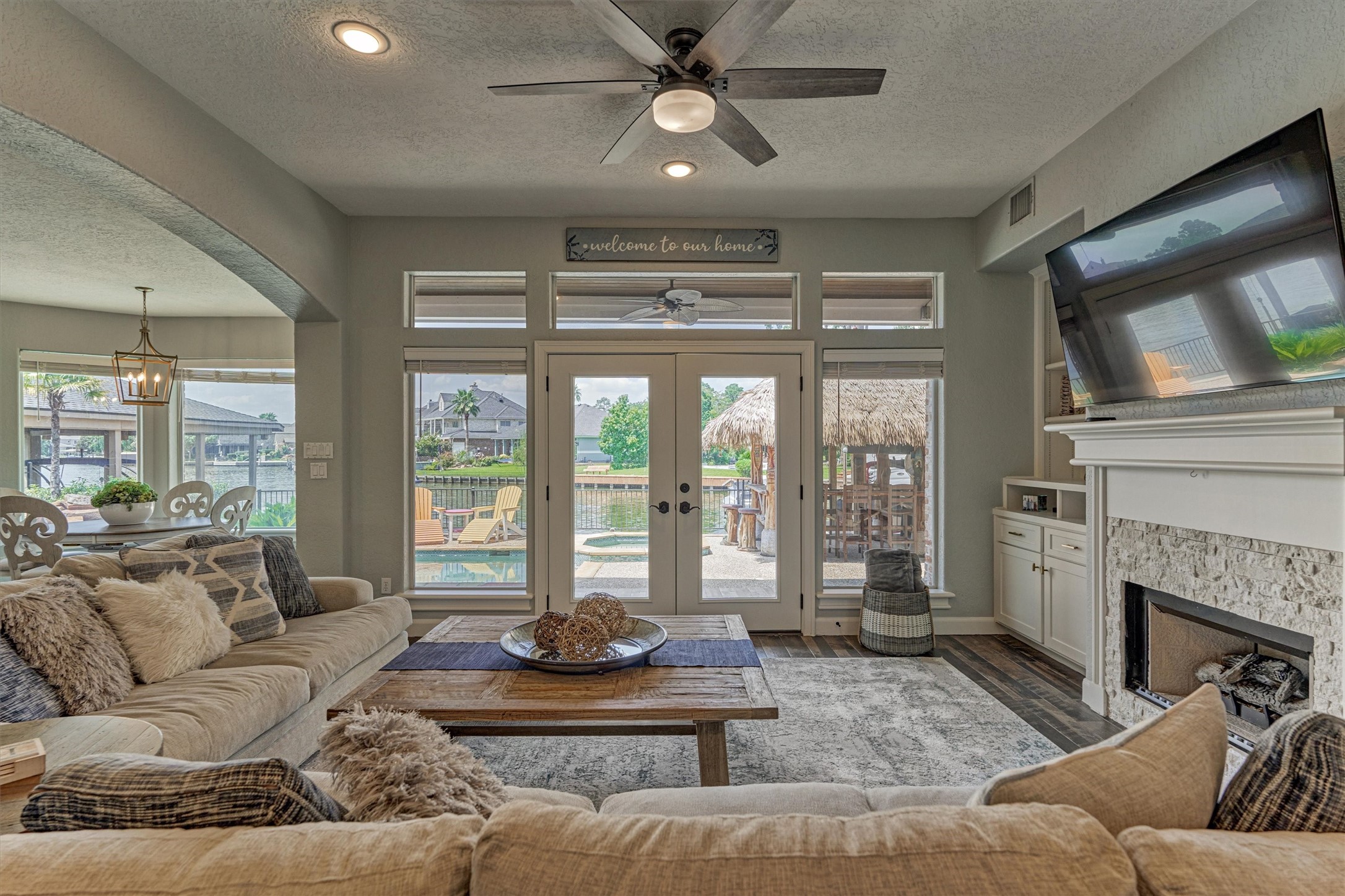 202 Edgemar Road Montgomery, TX 77356 - Photo 15 of 50 Indoor comfort meets outdoor fun—open the French doors and let the poolside paradise in.