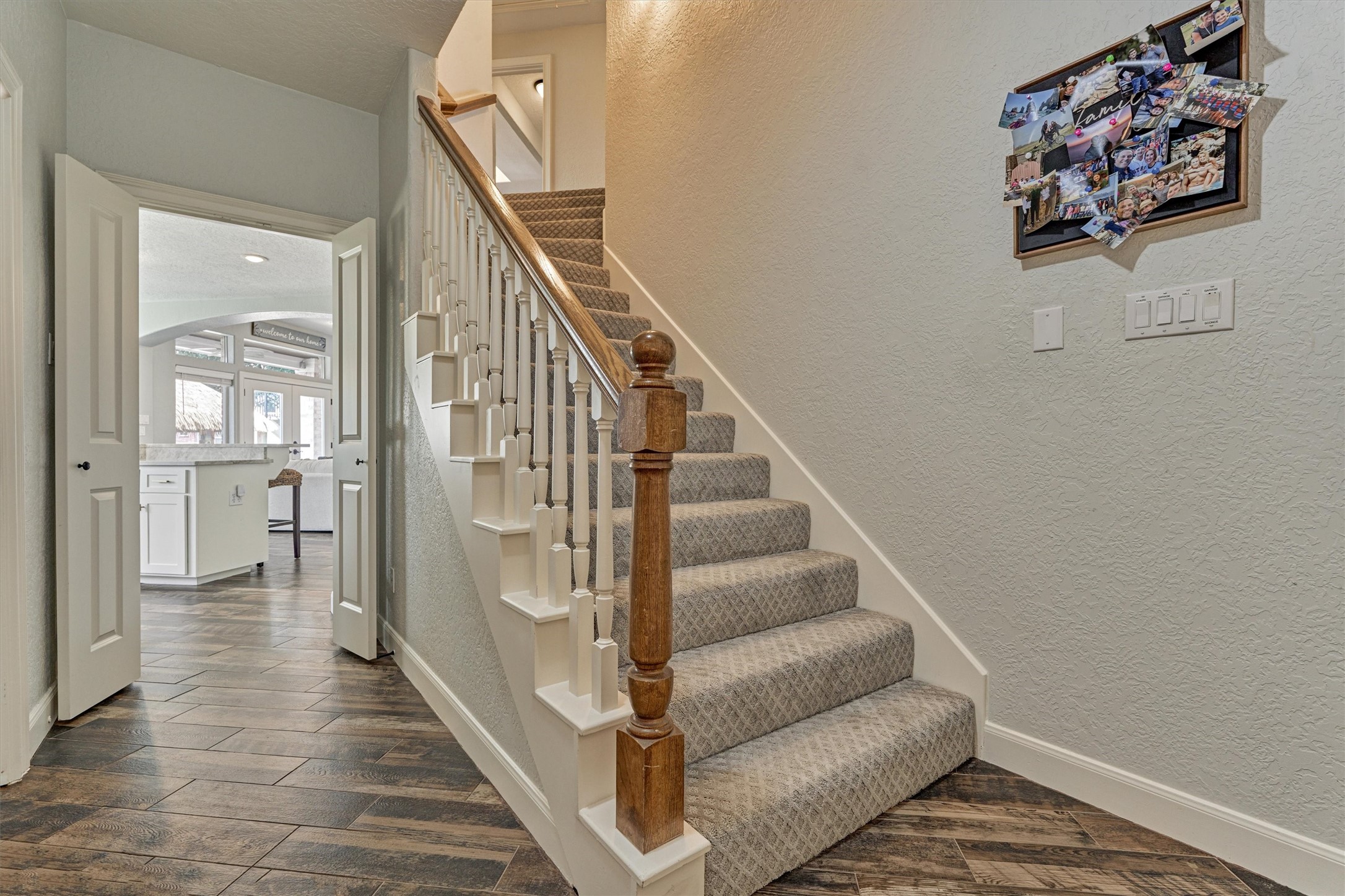 202 Edgemar Road Montgomery, TX 77356 - Photo 21 of 50 Double doors frame the kitchen, while a back hallway discreetly tucks away the laundry, garage access, and a second staircase to the game room and bedrooms.