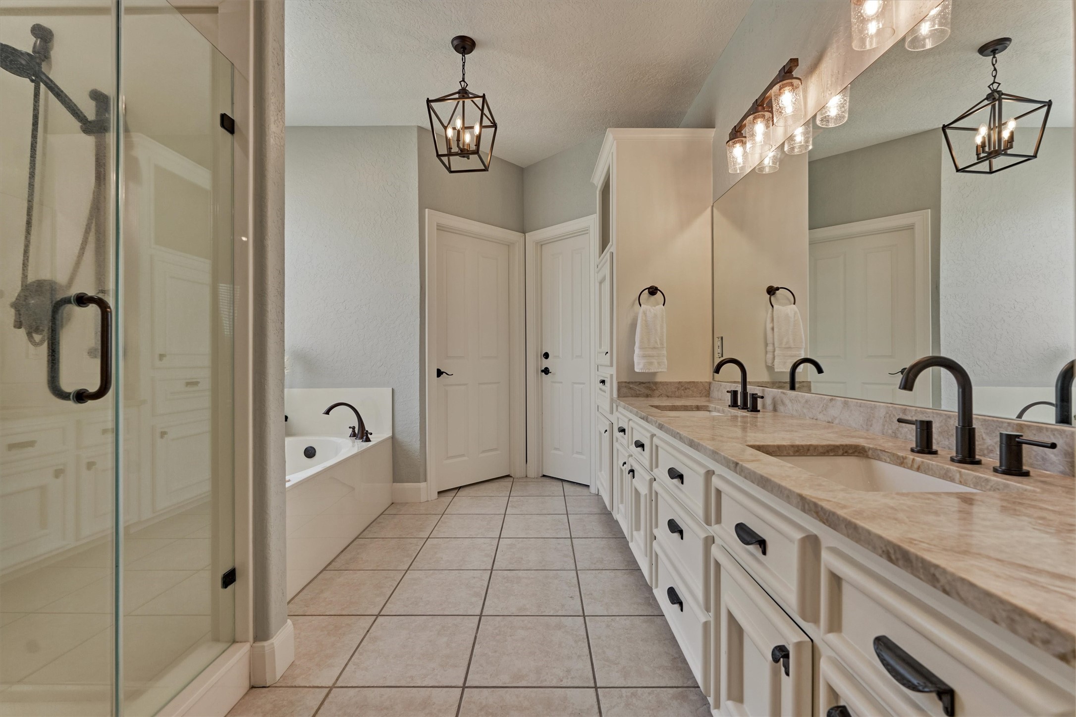 202 Edgemar Road Montgomery, TX 77356 - Photo 30 of 50 Elevated finishes include modern lighting, newly installed quartzite countertops, sleek undermount sinks, and matte black faucets for a contemporary touch.