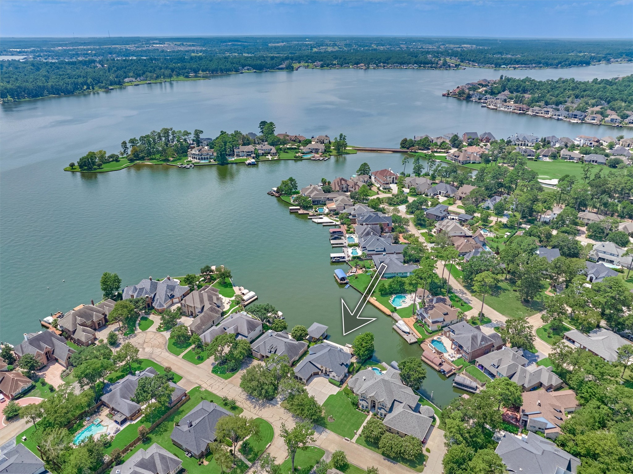 202 Edgemar Road Montgomery, TX 77356 - Photo 35 of 50 Perfectly positioned in a private Bentwater cove, yet just moments from the open waters of Lake Conroe, this luxury home offers the best of both worlds—whether as a weekend escape or your primary residence.