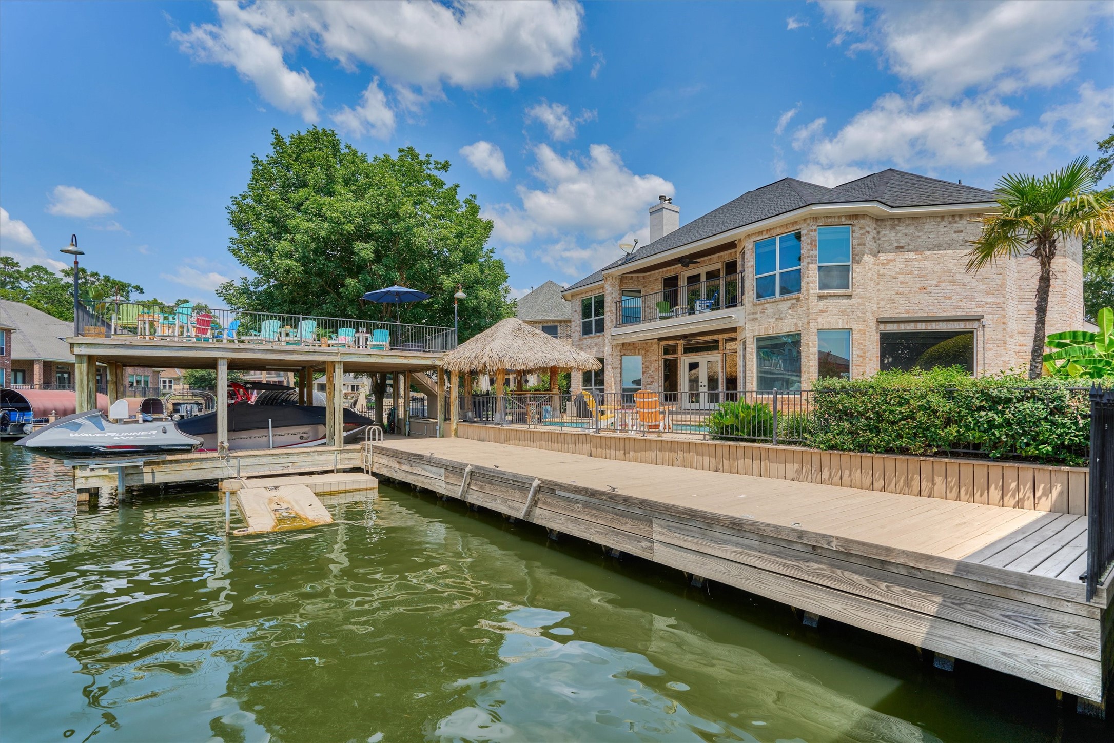 202 Edgemar Road Montgomery, TX 77356 - Photo 43 of 50 Ample room for all your lake toys—boats, jet skis, and watercraft each with their own docking space, plus storage for life vests, skis, and more.
