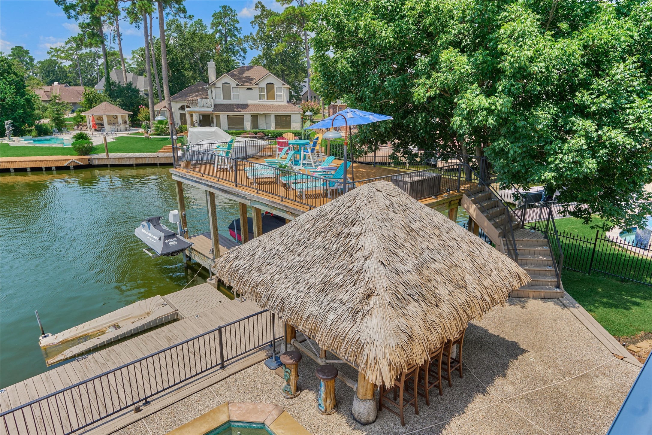 202 Edgemar Road Montgomery, TX 77356 - Photo 47 of 50 Truly one-of-a-kind, this grandfathered second-story deck is no longer permitted in the cove, offering a rare vantage point for sweeping lake views.