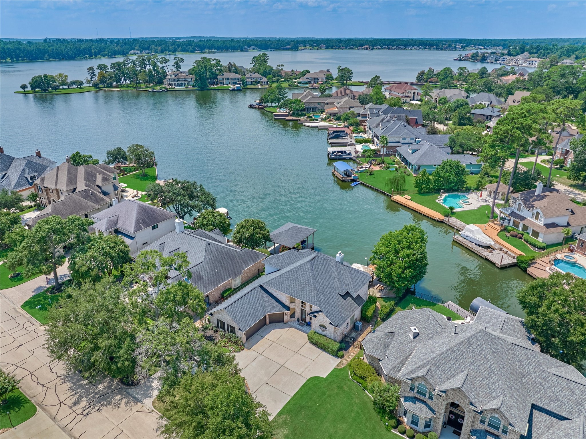 202 Edgemar Road Montgomery, TX 77356 - Photo 7 of 50 This aerial view highlights 202 Edgemar, gracefully set along the serene and private Bentwater cove.