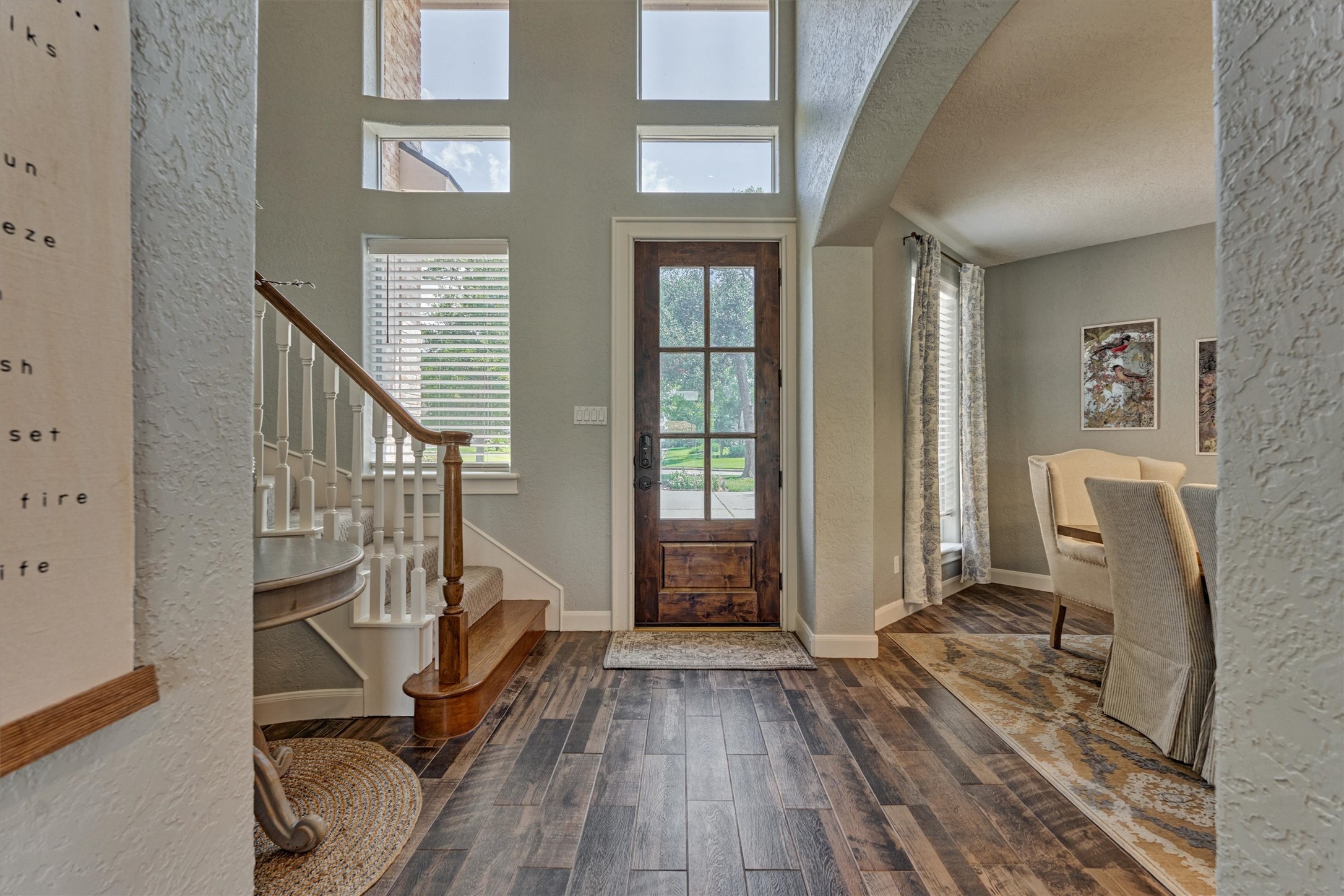 202 Edgemar Road Montgomery, TX 77356 - Photo 10 of 50 Alternate front view showcasing the soaring entryway. To the right, the formal dining room awaits family gatherings, while one of two staircases leads to the upstairs bedrooms.