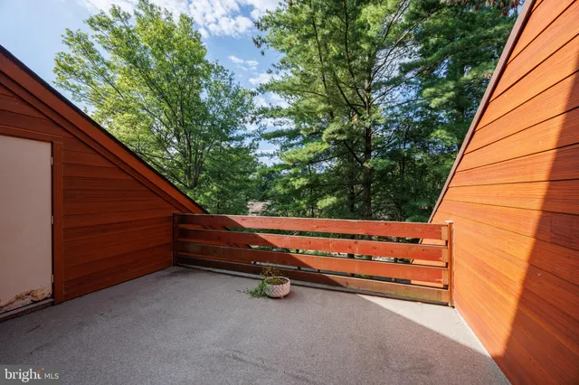 a view of backyard with outdoor seating and stairs