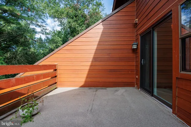 a view of backyard with stairs and wooden stairs