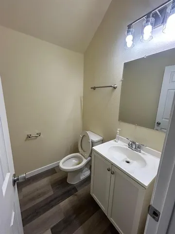 a bathroom with a sink toilet and vanity