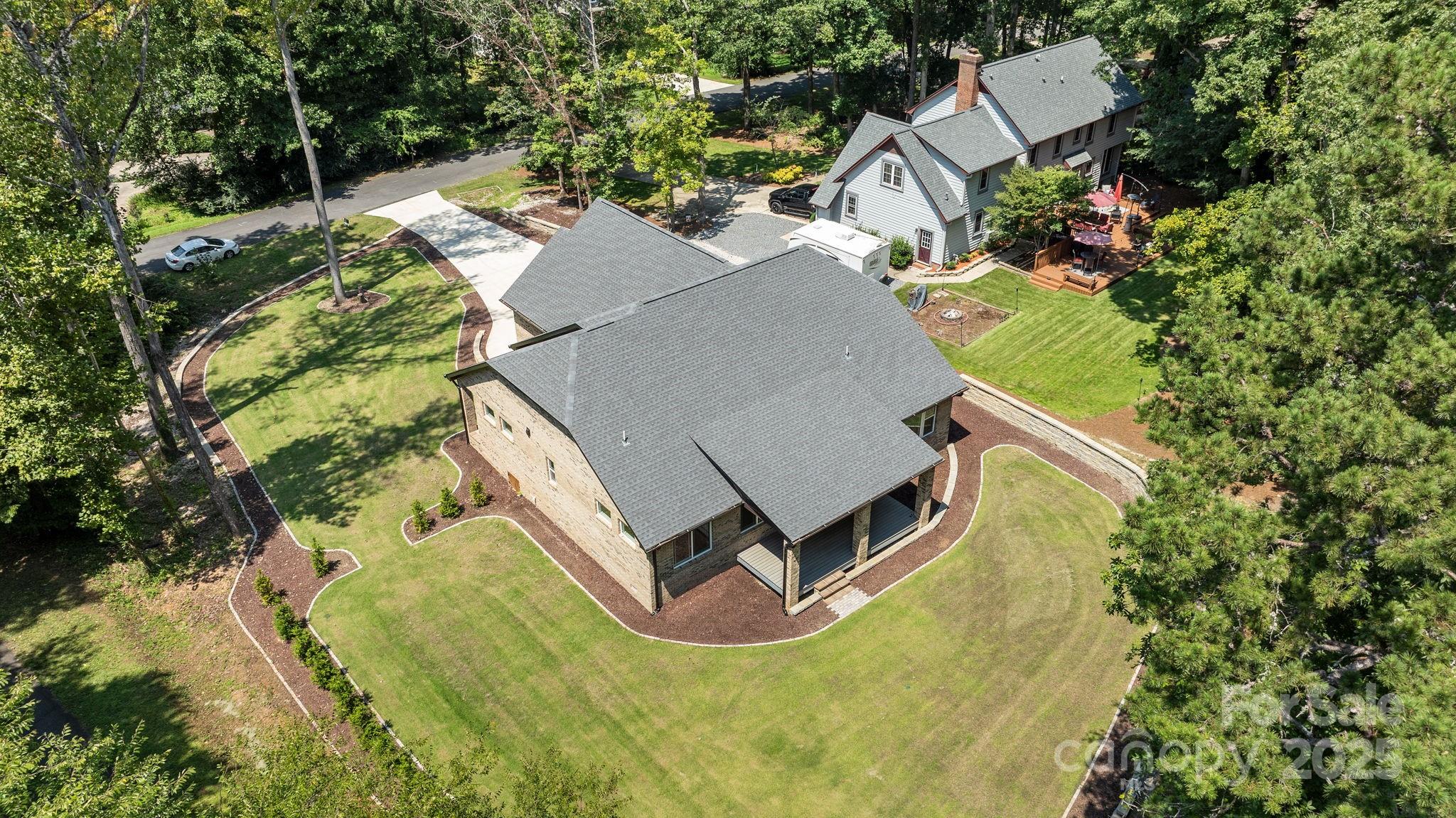 4531 Deer Run Rock Hill, SC 29732 - Photo 2 of 32 an aerial view of a house with a yard and trees