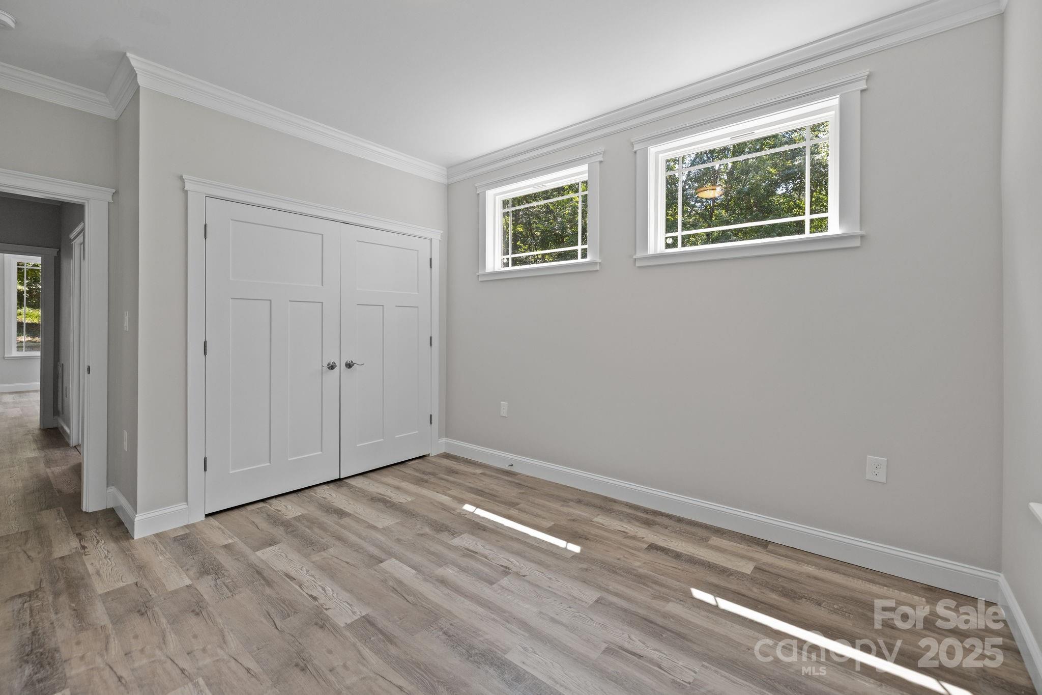 4531 Deer Run Rock Hill, SC 29732 - Photo 21 of 32 a view of an empty room with wooden floor and a window