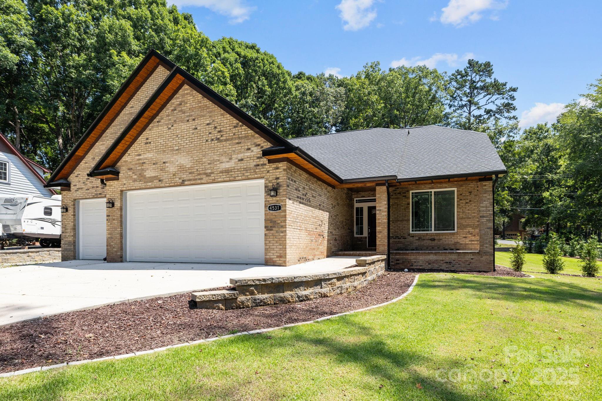 4531 Deer Run Rock Hill, SC 29732 - Photo 26 of 32 a front view of a house with a yard and garage