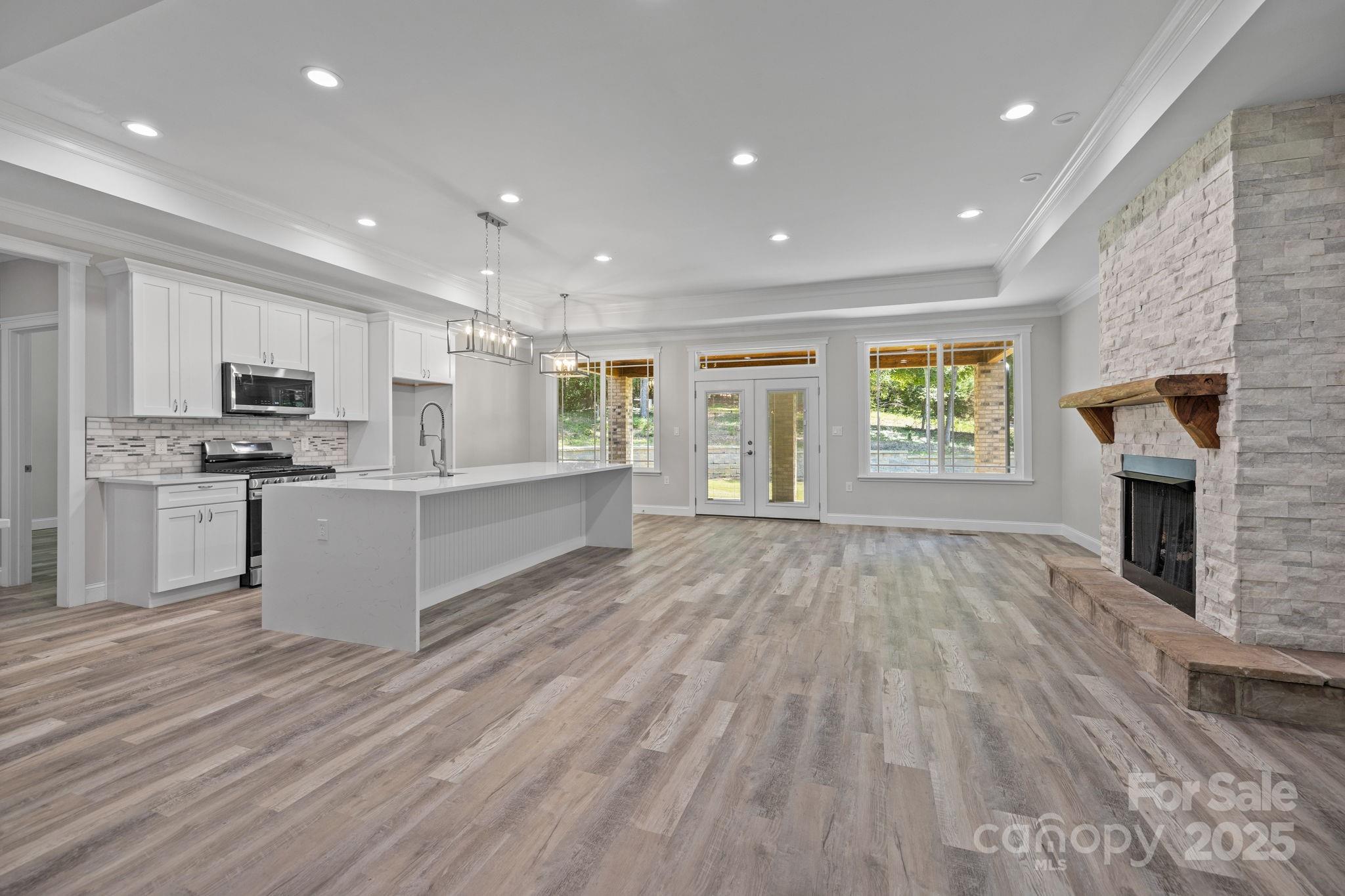 4531 Deer Run Rock Hill, SC 29732 - Photo 9 of 32 a large kitchen with stainless steel appliances granite countertop a large counter top and a stove top oven