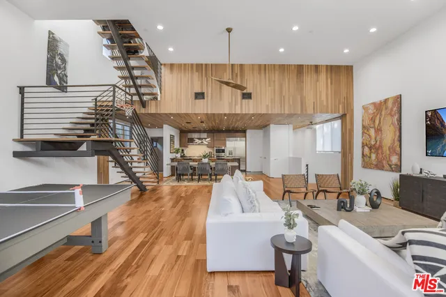 a large kitchen with a table and chairs