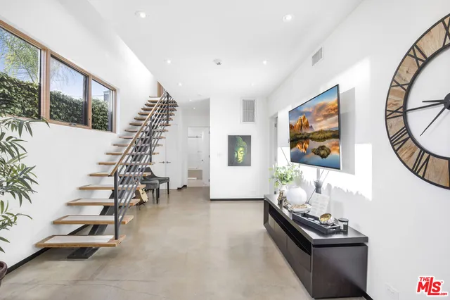 a room with furniture and stairs