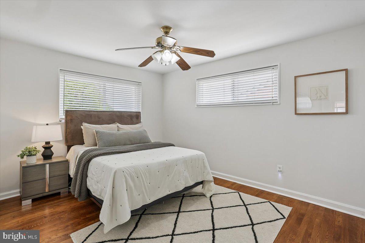 3709 Kenway Street Silver Spring, MD 20906 - Photo 21 of 34 a bedroom with a bed and a chandelier