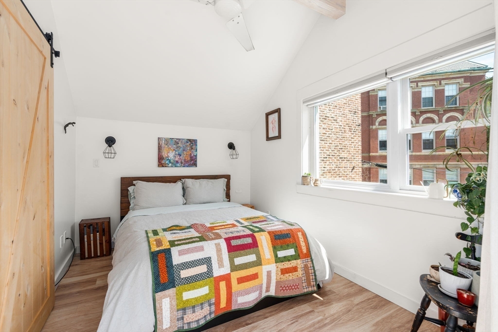 67 Dudley Street, Unit SF Boston, MA 02119 - Photo 5 of 28 a bedroom with a bed and a window