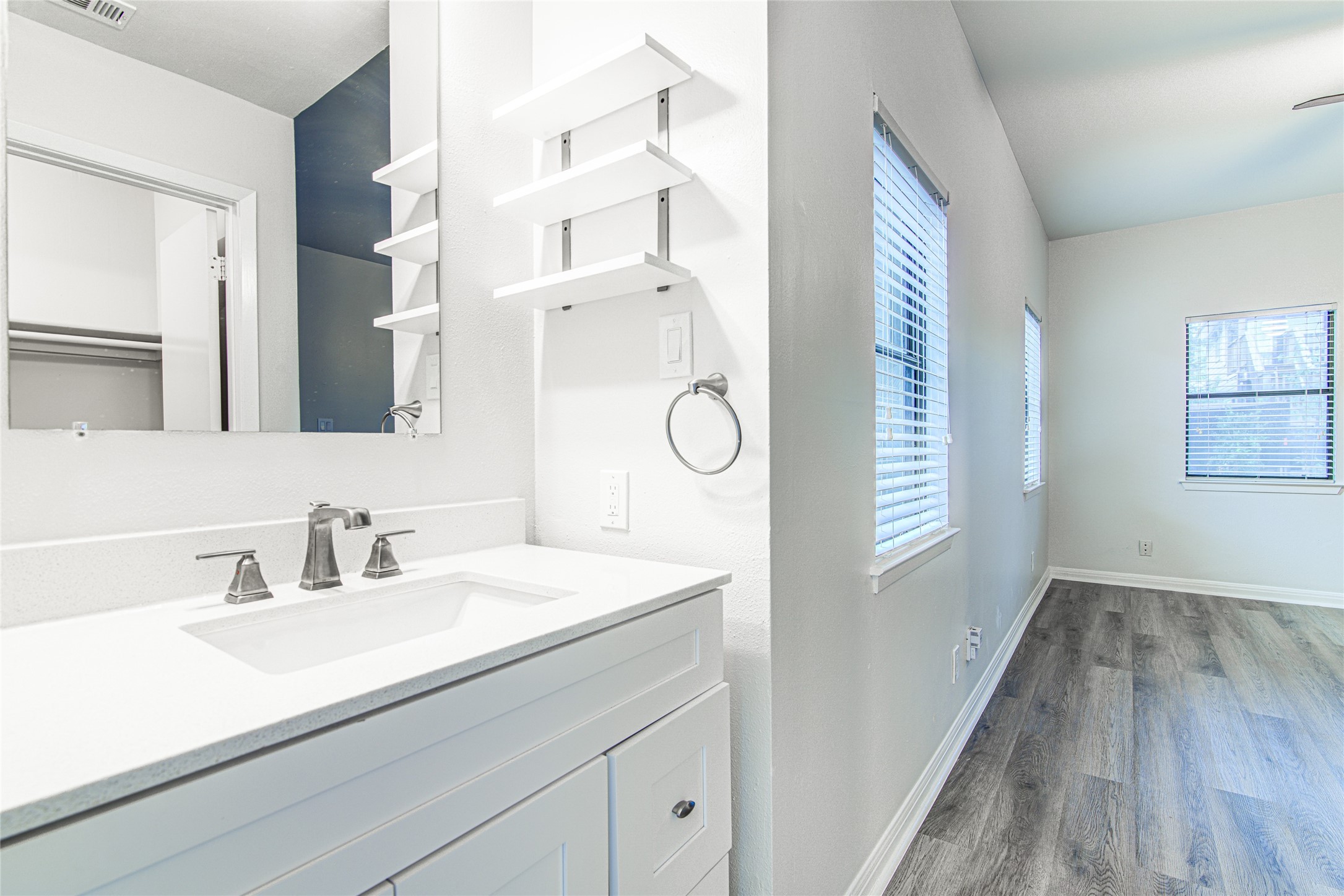 311 West Mary Street Austin, TX 78704 - Photo 21 of 35 A well-appointed bathroom vanity with a spacious countertop and sleek fixtures.