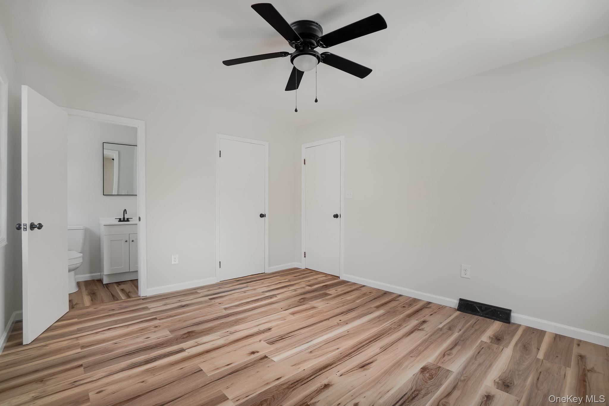 629 Twin Arch Road Rock Tavern, NY 12575 - Photo 15 of 24 an empty room with a window and a ceiling fan