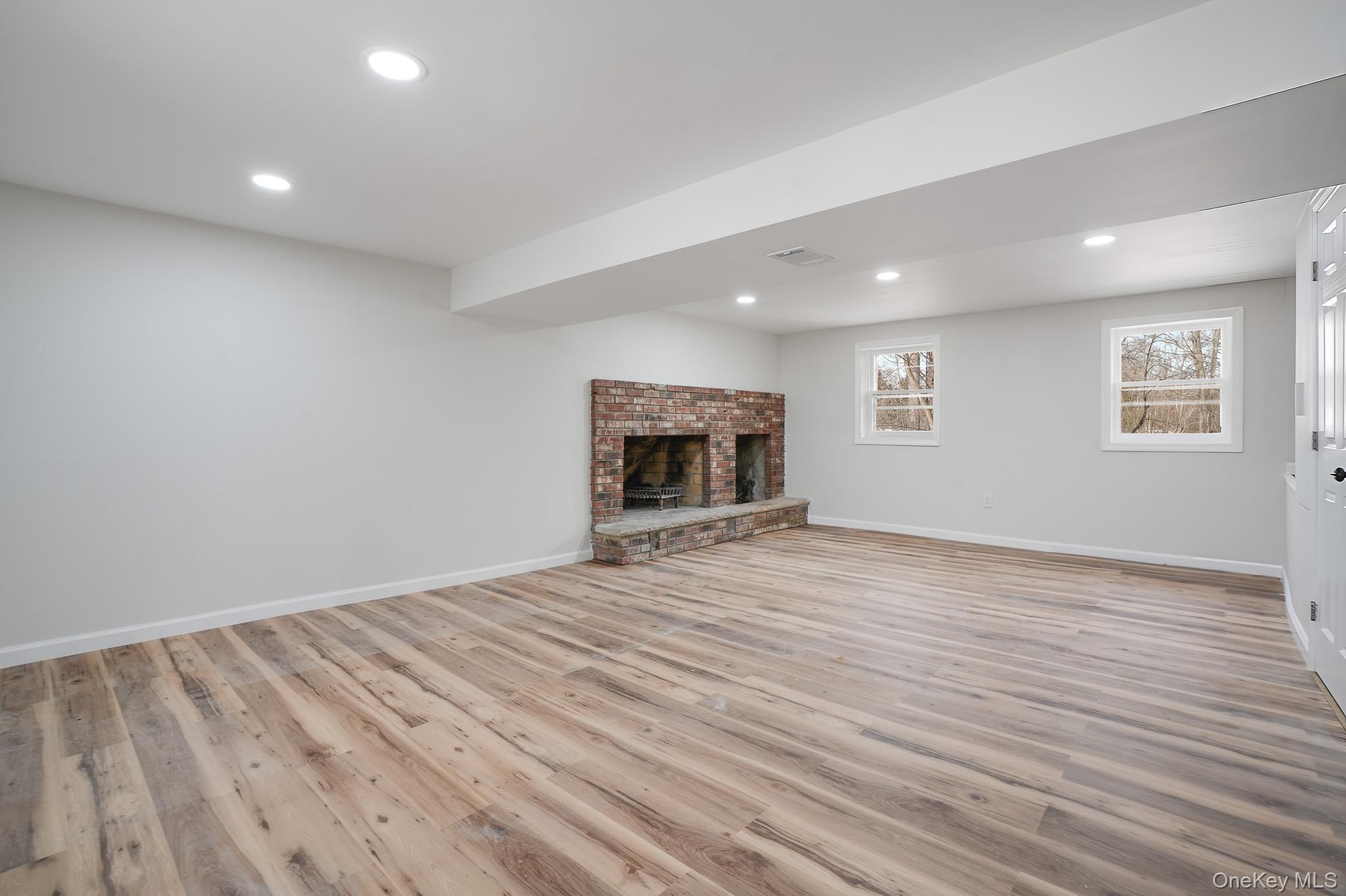 629 Twin Arch Road Rock Tavern, NY 12575 - Photo 19 of 24 a view of empty room with wooden floor and fireplace