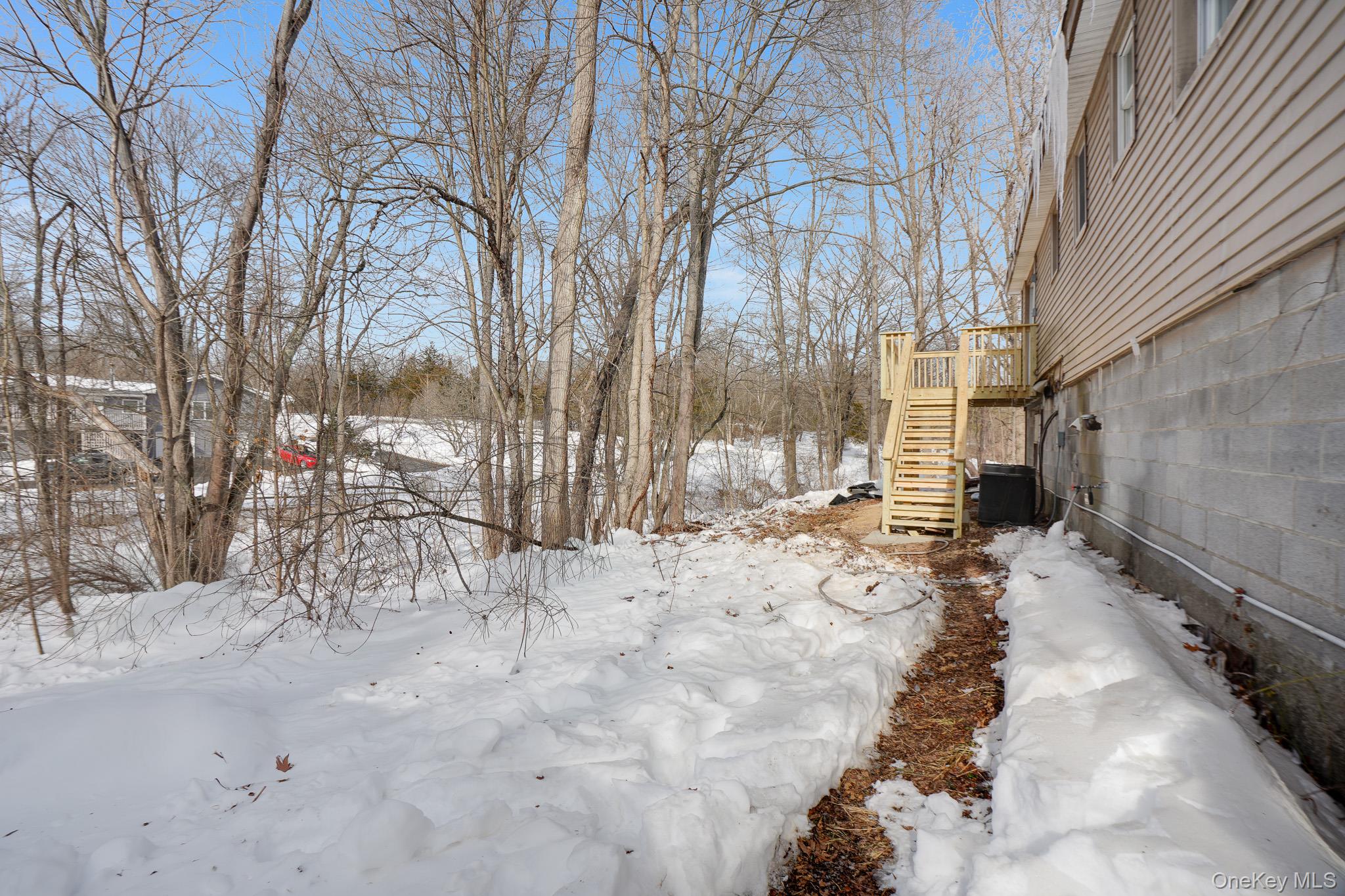 629 Twin Arch Road Rock Tavern, NY 12575 - Photo 23 of 24 a view of a yard covered in snow