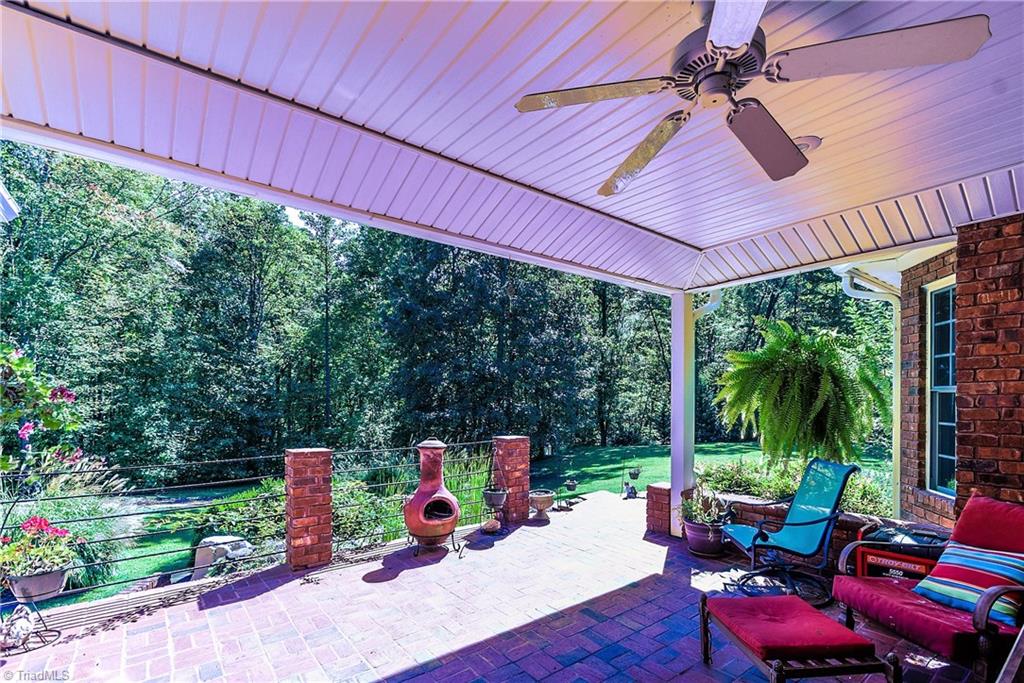 1295 East Westmoreland Road King, NC 27021 - Photo 14 of 17 Covered Patio with view of the Fish Pond