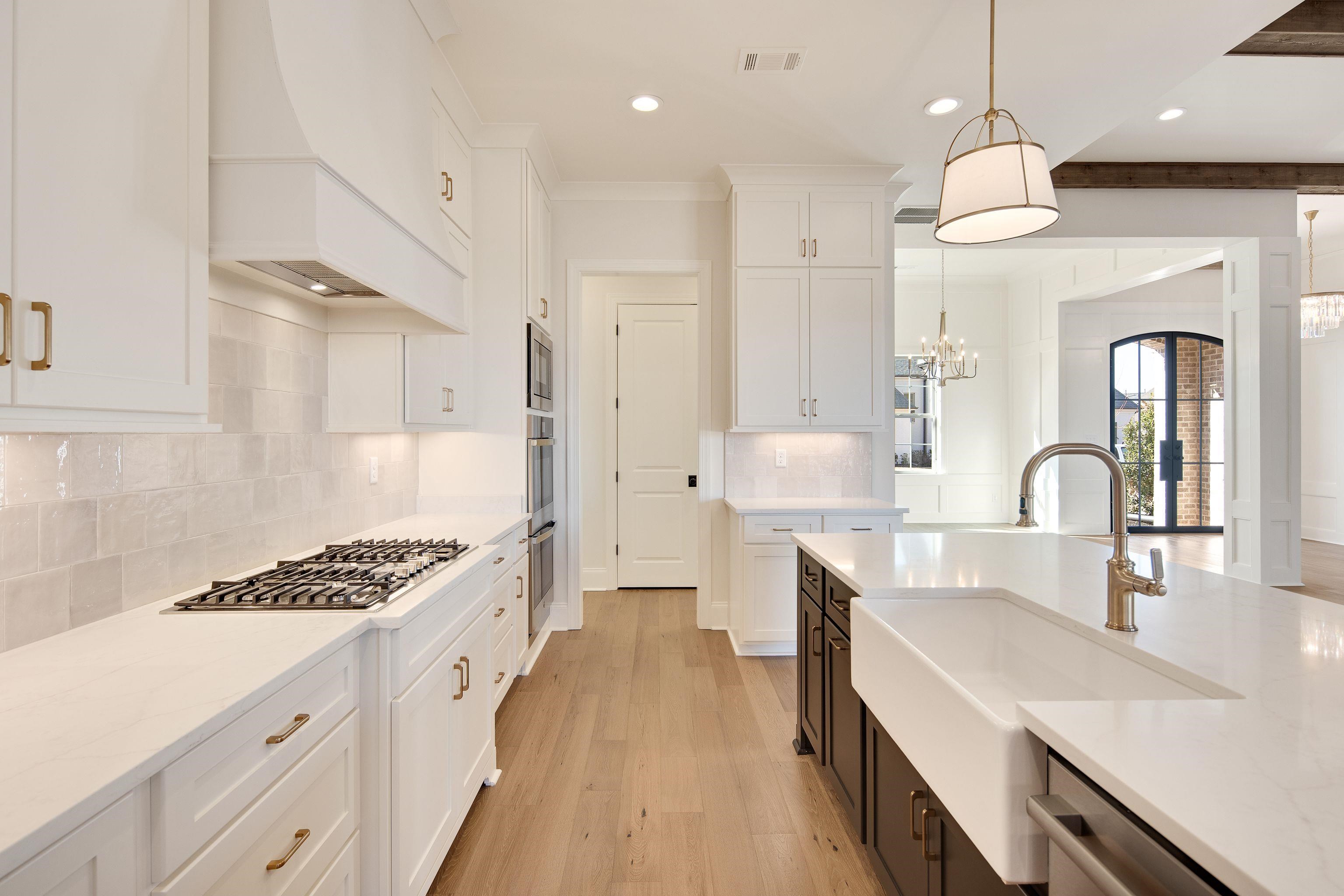 272 Keisie Lane Collierville, TN 38017 - Photo 11 of 30 a kitchen with kitchen island stainless steel appliances a sink stove and cabinets