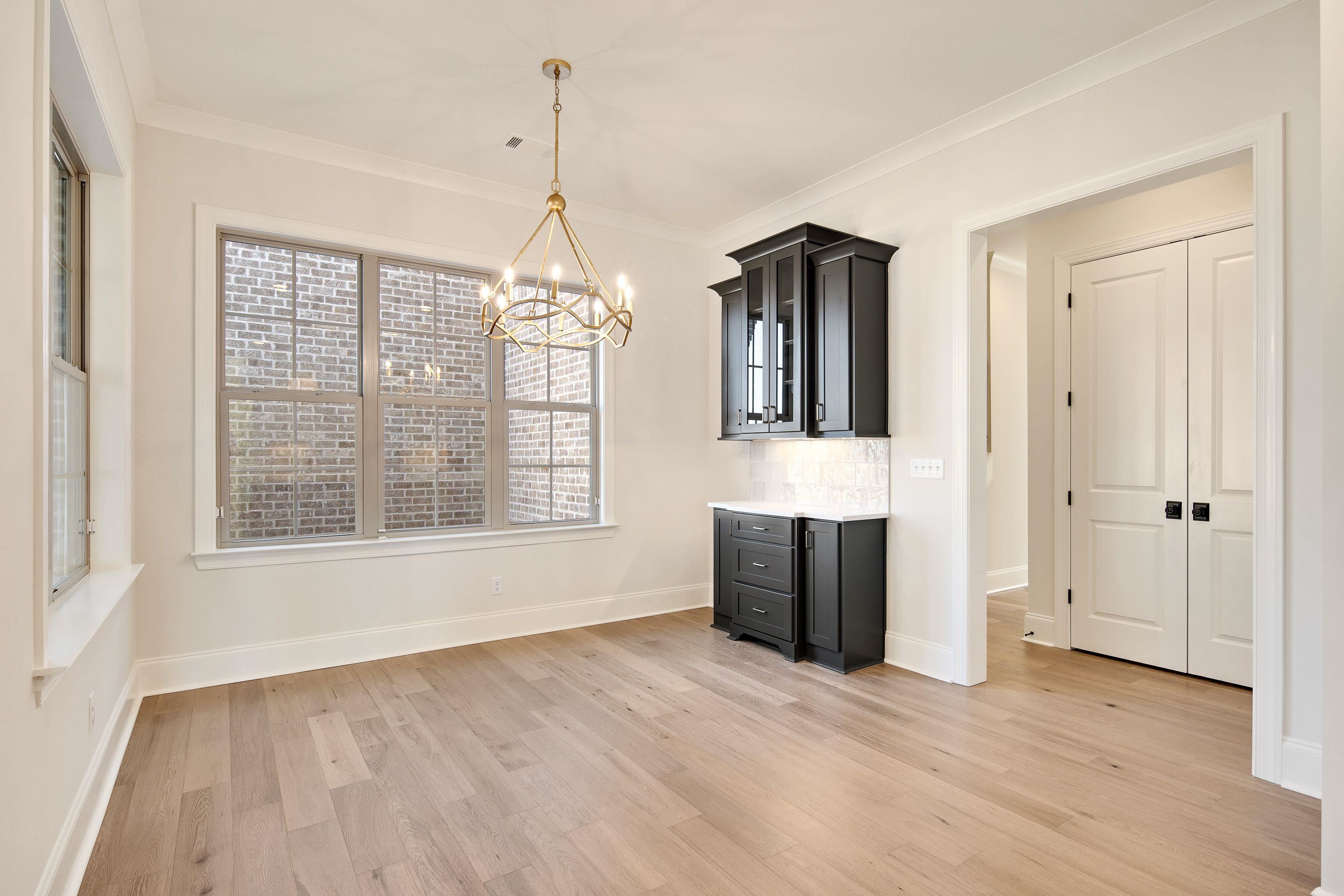 272 Keisie Lane Collierville, TN 38017 - Photo 13 of 30 a view of an empty room with wooden floor and a window