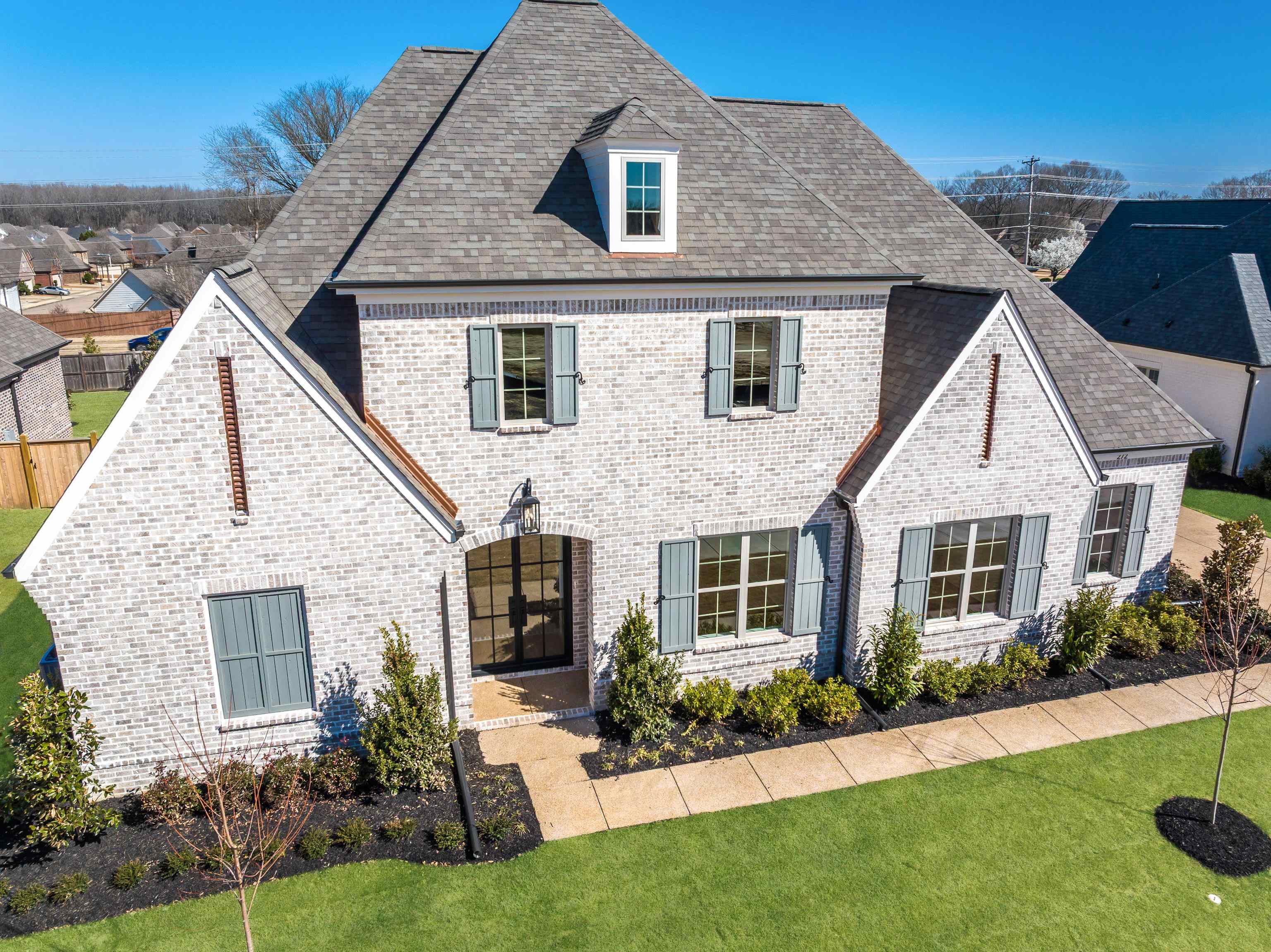 272 Keisie Lane Collierville, TN 38017 - Photo 2 of 30 a front view of a house with a yard and porch