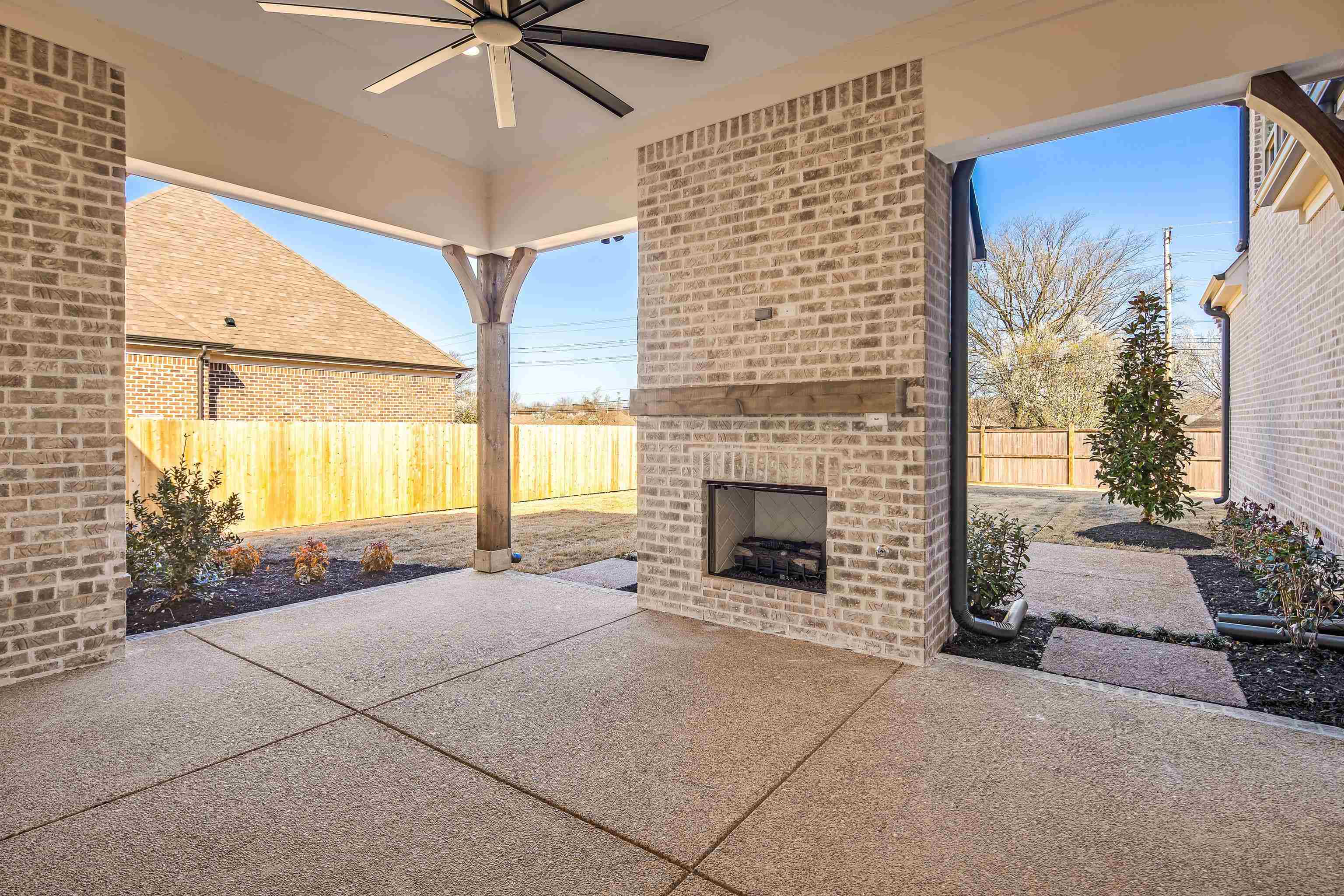 272 Keisie Lane Collierville, TN 38017 - Photo 21 of 30 a view of an empty room with a fireplace and a window