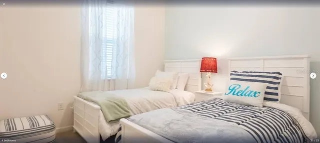 a bedroom with a bed and a book shelf