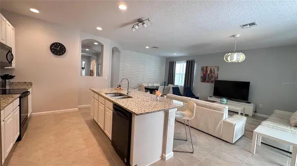 a room with furniture and a flat screen tv