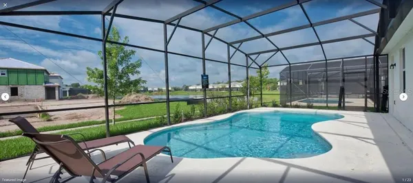 a view of backyard with sitting area