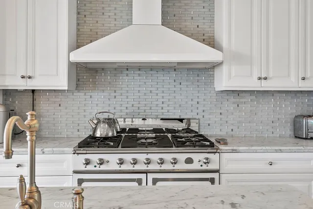 a living room with furniture a chandelier and a chandelier