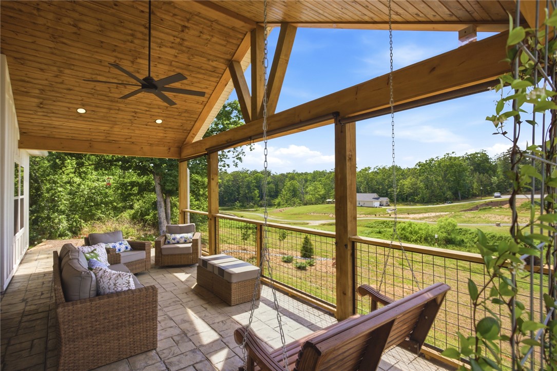 412 Chadwick Lane Walhalla, SC 29691 - Photo 28 of 37 Enjoy tranquil views from this spacious, covered patio with vaulted wood ceilings.