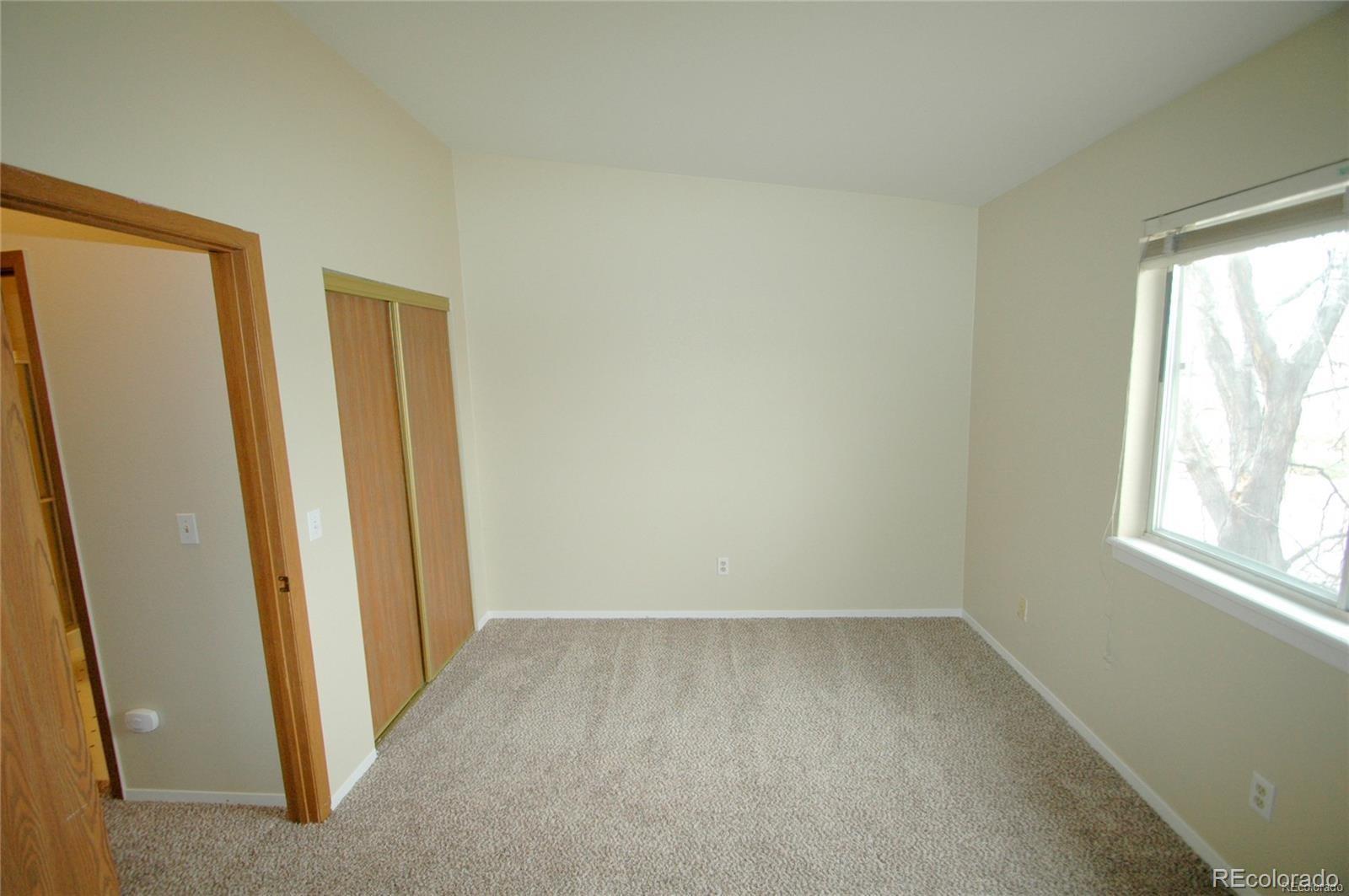 165 South Sable Boulevard, Unit R23 Aurora, CO 80012 - Photo 11 of 11 an empty room with windows