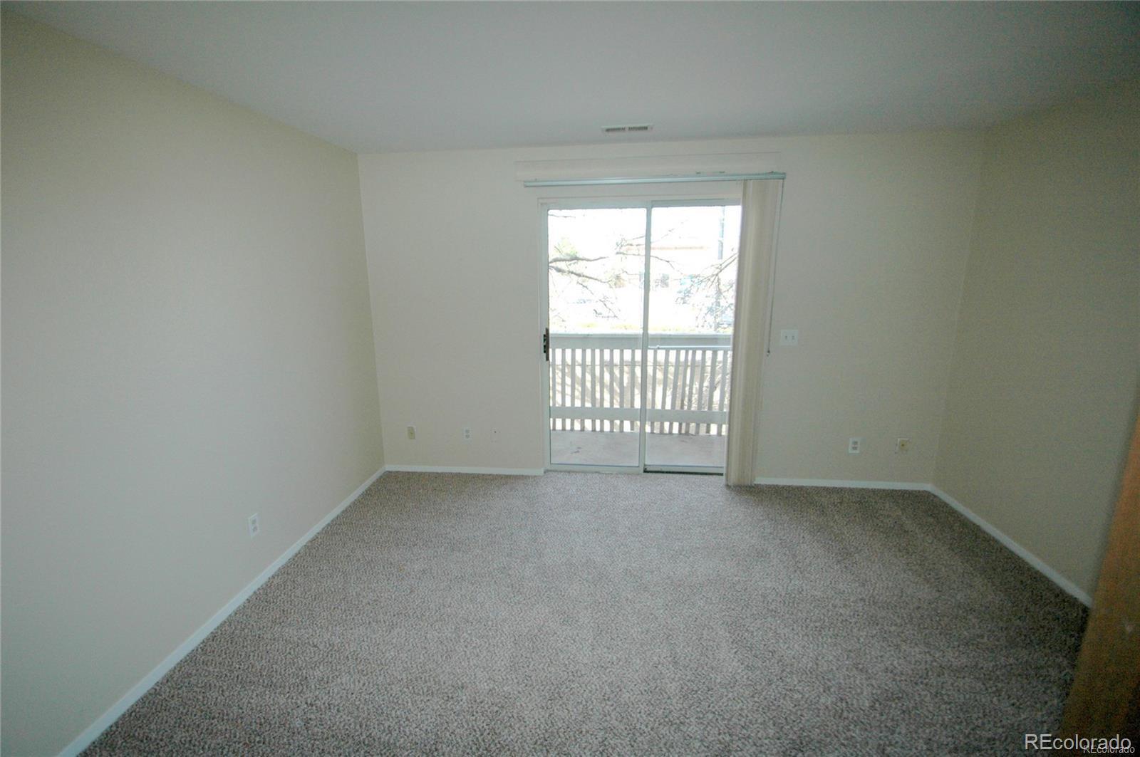 165 South Sable Boulevard, Unit R23 Aurora, CO 80012 - Photo 7 of 11 an empty room with windows
