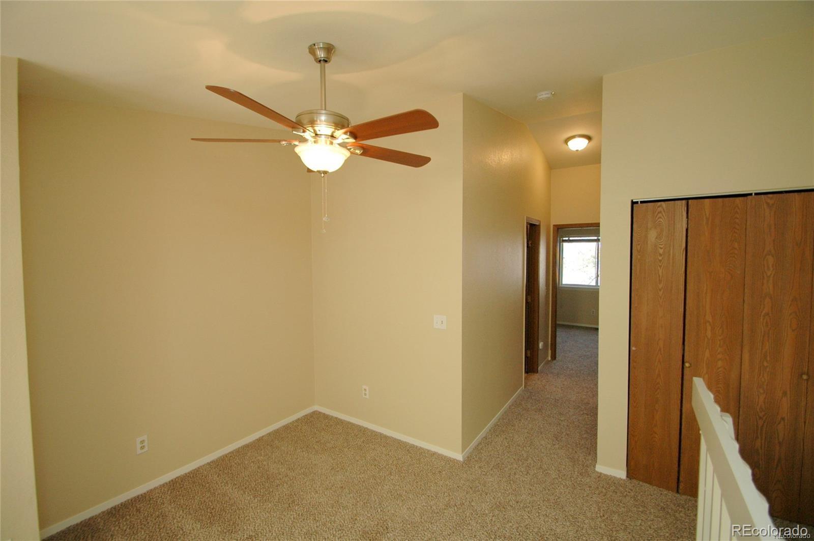 165 South Sable Boulevard, Unit R23 Aurora, CO 80012 - Photo 10 of 11 wooden floor in an empty room