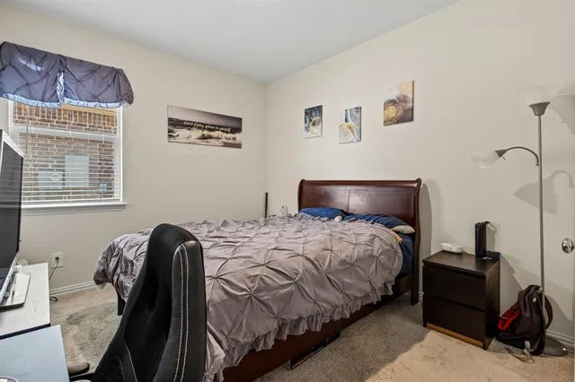 a bedroom with a bed and a closet