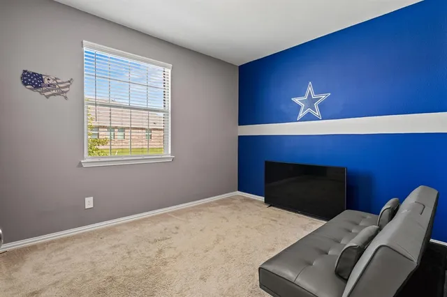 a bedroom with bed and a window